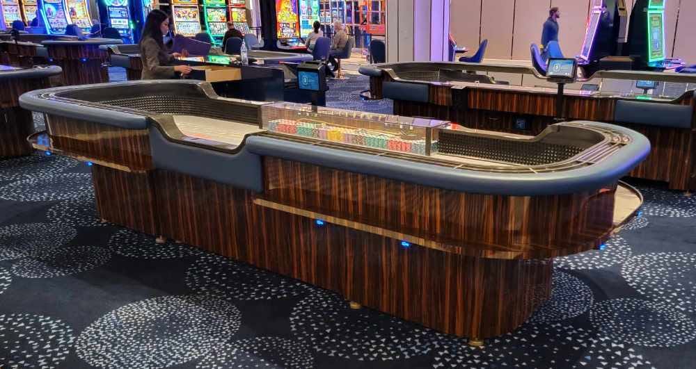 Casino table game with SitNCharge charging installed