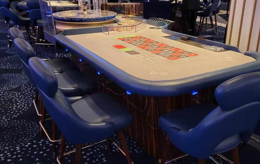 Roulette table with SitNCharge blue LED charging ports