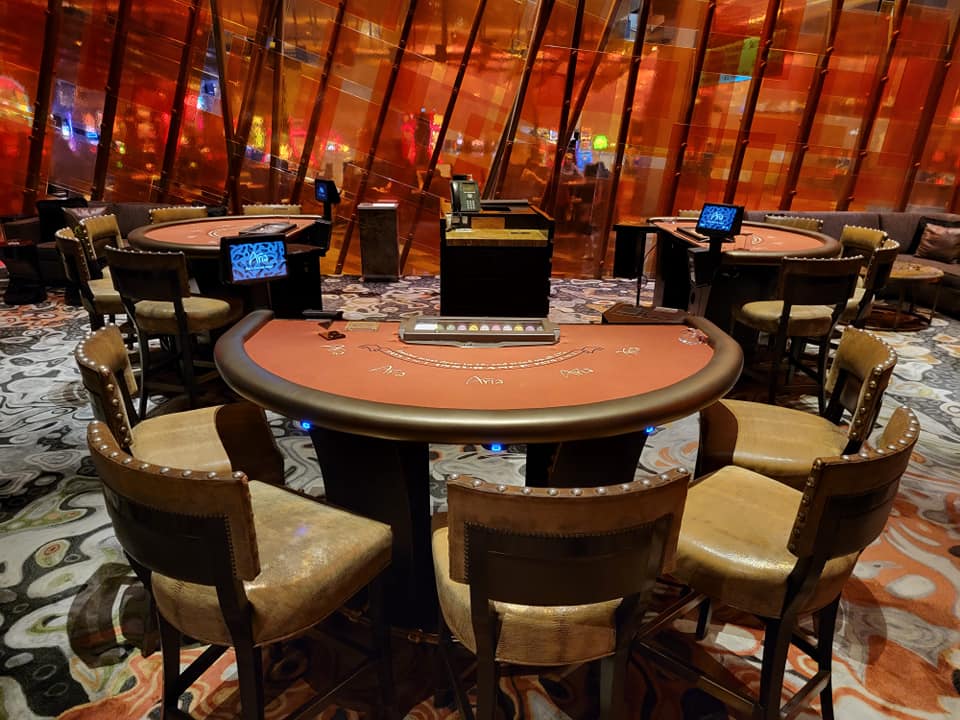 Luxury casino poker room with orange felt